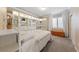 Comfortable bedroom with built-in shelving, neutral walls, carpet, and natural light at 5823 Falling Stream Ave, Las Vegas, NV 89131