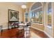 Charming dining area with a large window showcasing the landscaped backyard and a bistro table at 5823 Falling Stream Ave, Las Vegas, NV 89131