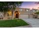 Charming two-story home with manicured lawn, mature trees, and a three-car garage at 5823 Falling Stream Ave, Las Vegas, NV 89131