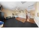 Spacious home gym with hardwood and rubber flooring plus exercise equipment at 5823 Falling Stream Ave, Las Vegas, NV 89131