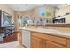 Open kitchen featuring ample counter space, a sink, and a view of the living area at 5823 Falling Stream Ave, Las Vegas, NV 89131
