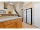 Bright kitchen with light wood cabinets, an island, and a sleek white refrigerator at 5823 Falling Stream Ave, Las Vegas, NV 89131