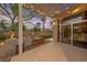 Inviting outdoor patio with a cozy fire pit and well-manicured landscaping at 5823 Falling Stream Ave, Las Vegas, NV 89131