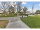 Picturesque park setting with walking paths, benches, grassy areas, and an American flag at 5823 Falling Stream Ave, Las Vegas, NV 89131