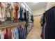 Organized walk-in closet with shelving, hanging rods, and storage solutions for clothes and accessories at 5823 Falling Stream Ave, Las Vegas, NV 89131