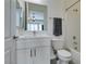 Bright bathroom with a modern vanity, neutral tiling, and a tub with shower combination at 6131 Rio Vista St, Las Vegas, NV 89130