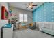 bedroom with cloud wallpaper, a ceiling fan, and a window with wooden blinds at 6131 Rio Vista St, Las Vegas, NV 89130