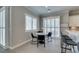 Breakfast nook with white marble table, seating, and views to the landscaped backyard at 6131 Rio Vista St, Las Vegas, NV 89130