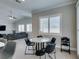 Stylish breakfast nook featuring contemporary table and chairs, and plantation shutters for privacy at 6131 Rio Vista St, Las Vegas, NV 89130