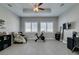 Bright exercise room with a ceiling fan, white window shutters, and a massage chair at 6131 Rio Vista St, Las Vegas, NV 89130