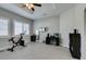 Bright exercise room and office space with white window shutters and modern lighting at 6131 Rio Vista St, Las Vegas, NV 89130