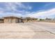 Attractive single-story home with a three-car garage, complemented by a driveway and desert landscaping at 6131 Rio Vista St, Las Vegas, NV 89130