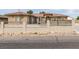 Lovely home with a basketball hoop in the driveway and metal fencing at 6131 Rio Vista St, Las Vegas, NV 89130