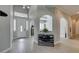 Inviting foyer with wood-look tile flooring, arched doorways, and neutral paint at 6131 Rio Vista St, Las Vegas, NV 89130