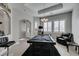 Elegant game room featuring a pool table, window shutters, and an arched doorway, perfect for gatherings at 6131 Rio Vista St, Las Vegas, NV 89130