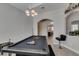 Bright game room with a pool table, an arched doorway, and modern decor, ideal for entertainment at 6131 Rio Vista St, Las Vegas, NV 89130