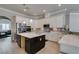 Gourmet kitchen with stainless appliances, quartz countertops, and stylish backsplash and large island at 6131 Rio Vista St, Las Vegas, NV 89130