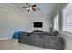 Open living room features vaulted ceilings, tile floors, and modern furniture at 6131 Rio Vista St, Las Vegas, NV 89130