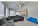Bright open-concept living space with large sectional, dining area, and kitchen with counter seating at 6131 Rio Vista St, Las Vegas, NV 89130