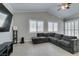 Spacious living room features vaulted ceiling, modern gray sectional, and bright windows at 6131 Rio Vista St, Las Vegas, NV 89130