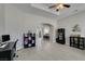 Spacious living room with vaulted ceilings, tile floors, contemporary furnishings, and a ceiling fan at 6131 Rio Vista St, Las Vegas, NV 89130