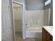 Bathroom with a tub and shower combo and a view into the walk-in closet at 6170 E Sahara Ave # 1012, Las Vegas, NV 89142
