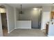 Open dining area features new flooring, neutral colored walls, and modern lighting at 6170 E Sahara Ave # 1012, Las Vegas, NV 89142