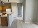 Kitchen featuring wood cabinets, breakfast bar, and a view into the living area at 6170 E Sahara Ave # 1012, Las Vegas, NV 89142