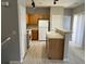 The modern kitchen boasts wood cabinets, stainless steel appliances, and a breakfast bar at 6170 E Sahara Ave # 1012, Las Vegas, NV 89142