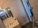 Traditional bathroom featuring a single-sink vanity and a framed mirror at 6231 Santa Maria Ave, Las Vegas, NV 89108