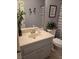 Standard bathroom featuring a toilet, sink with vanity, and a shower/tub combo with a striped curtain at 6231 Santa Maria Ave, Las Vegas, NV 89108