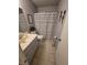 Standard bathroom featuring a toilet, sink with vanity, and a shower/tub combo with a striped curtain at 6231 Santa Maria Ave, Las Vegas, NV 89108