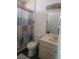 Compact bathroom featuring a shower-tub combo, vanity with sink, and a decorative shower curtain at 6231 Santa Maria Ave, Las Vegas, NV 89108