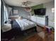 Well-lit bedroom with a large window, ample storage and hardwood floors at 6231 Santa Maria Ave, Las Vegas, NV 89108