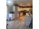Functional kitchen features neutral tile floors and white cabinetry at 6231 Santa Maria Ave, Las Vegas, NV 89108