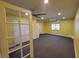 Spacious living room with neutral carpet, bright yellow walls, and a ceiling fan for comfort at 6231 Santa Maria Ave, Las Vegas, NV 89108