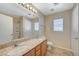 Bathroom features double sinks, a granite countertop, and a shower-tub combo with neutral walls at 6255 W Arby Ave # 258, Las Vegas, NV 89118