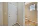 Convenient half bathroom features tile flooring, a toilet, and a window at 6255 W Arby Ave # 258, Las Vegas, NV 89118