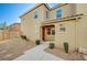 Welcoming two-story home featuring desert landscaping and a tiled roof under a clear blue sky at 6255 W Arby Ave # 258, Las Vegas, NV 89118