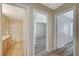 Hallway view showcasing seamless flow and access to the bathroom and a bedroom at 6255 W Arby Ave # 258, Las Vegas, NV 89118