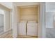 Laundry closet showcasing a stacked washer and dryer for space-saving convenience at 6255 W Arby Ave # 258, Las Vegas, NV 89118