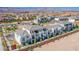 Elevated view of townhomes with private balconies and desert landscaping showcases the community's design and neighborhood at 6288 Dolosonte St, Las Vegas, NV 89113
