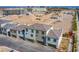 An aerial perspective shows townhomes and surrounding construction area, providing a view of the community's layout at 6288 Dolosonte St, Las Vegas, NV 89113