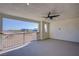 The covered balcony is spacious, with views of the neighborhood, and bright blue skies above at 6288 Dolosonte St, Las Vegas, NV 89113
