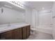 Well-lit bathroom with a modern vanity and tiled shower and tub combo at 6288 Dolosonte St, Las Vegas, NV 89113