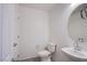 The half bathroom has a modern sink, an attractive mirror, and nice gray tile flooring at 6288 Dolosonte St, Las Vegas, NV 89113