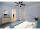 Cozy bedroom featuring a ceiling fan, soft carpet, and a closet with plenty of space at 6288 Dolosonte St, Las Vegas, NV 89113