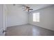 Cozy bedroom features a ceiling fan and tiled floors at 6288 Dolosonte St, Las Vegas, NV 89113