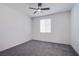 This carpeted bedroom features a window to provide natural lighting, and has white walls at 6288 Dolosonte St, Las Vegas, NV 89113