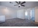 Spacious bonus room with plush carpeting and a modern ceiling fan at 6288 Dolosonte St, Las Vegas, NV 89113